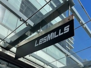 Custom signage graphics showcasing Refined NZ branding, applied to a commercial exterior surface.